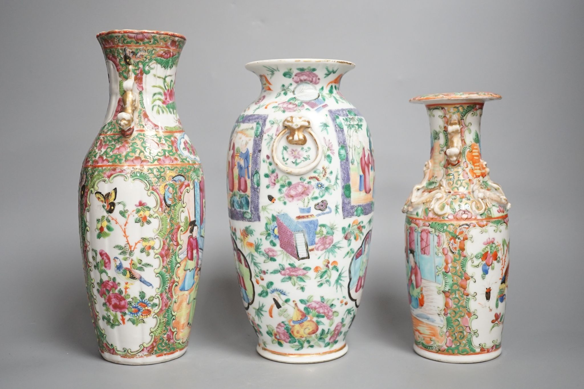 Three 19th century Chinese famille rose vases, Tallest 25 cms high.